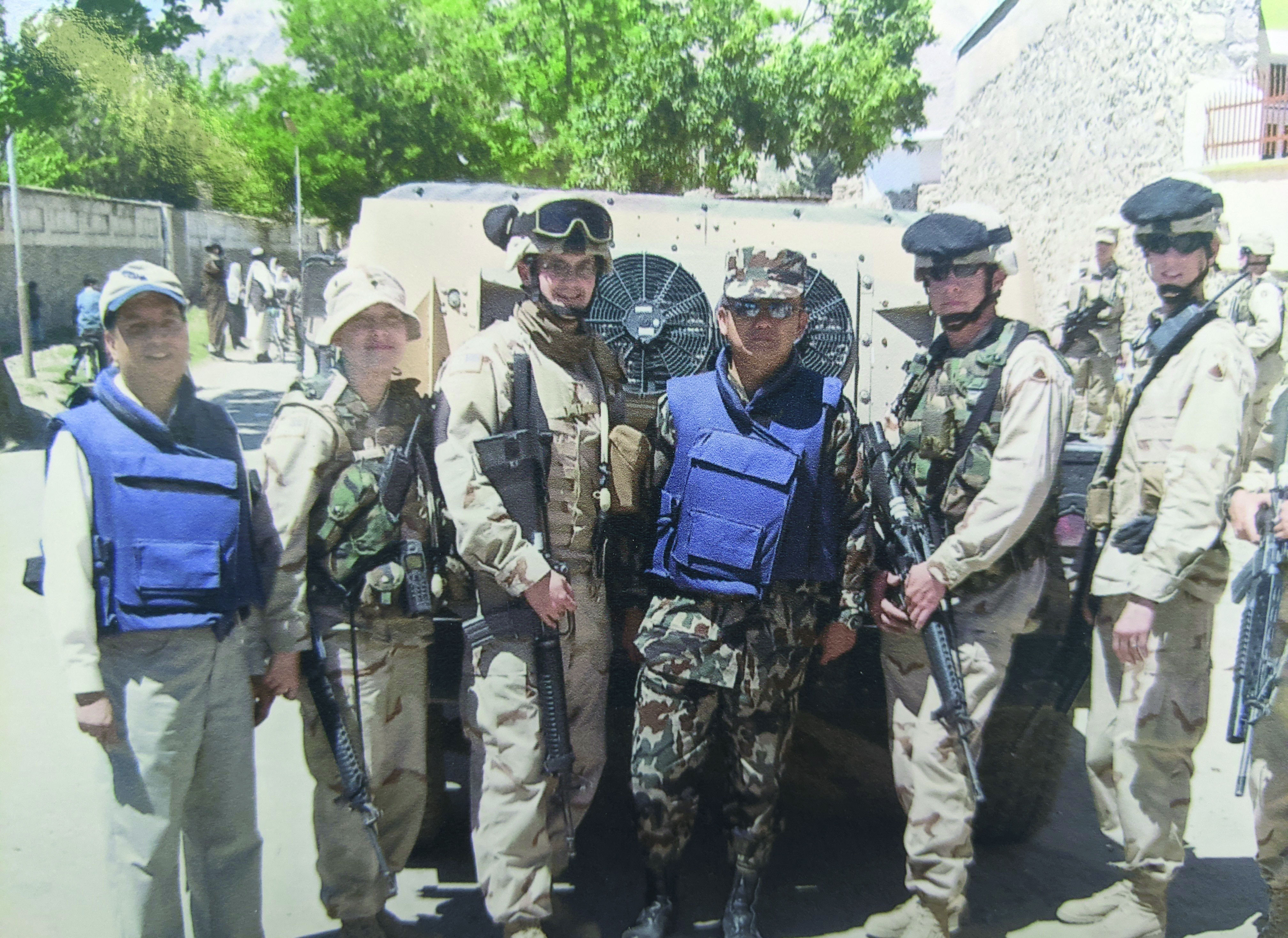 Members of 44th Signal Battalion, Mannheim,
        Germany, escort General Limbu from Nepal who
        was observing the U.S. humanitarian mission
        activities in local villages and schools in Parwan
        Province. Pictured left to right: unknown, SPC
        Elizabeth Navarro, SPC Tim Beckwith, General
        Limbu from Nepal, SPC Coty McCartney, SPC Adam
        Richardson, CPL Sergey Batyrshin. (Photo courtesy
        of SFC Beckwith)